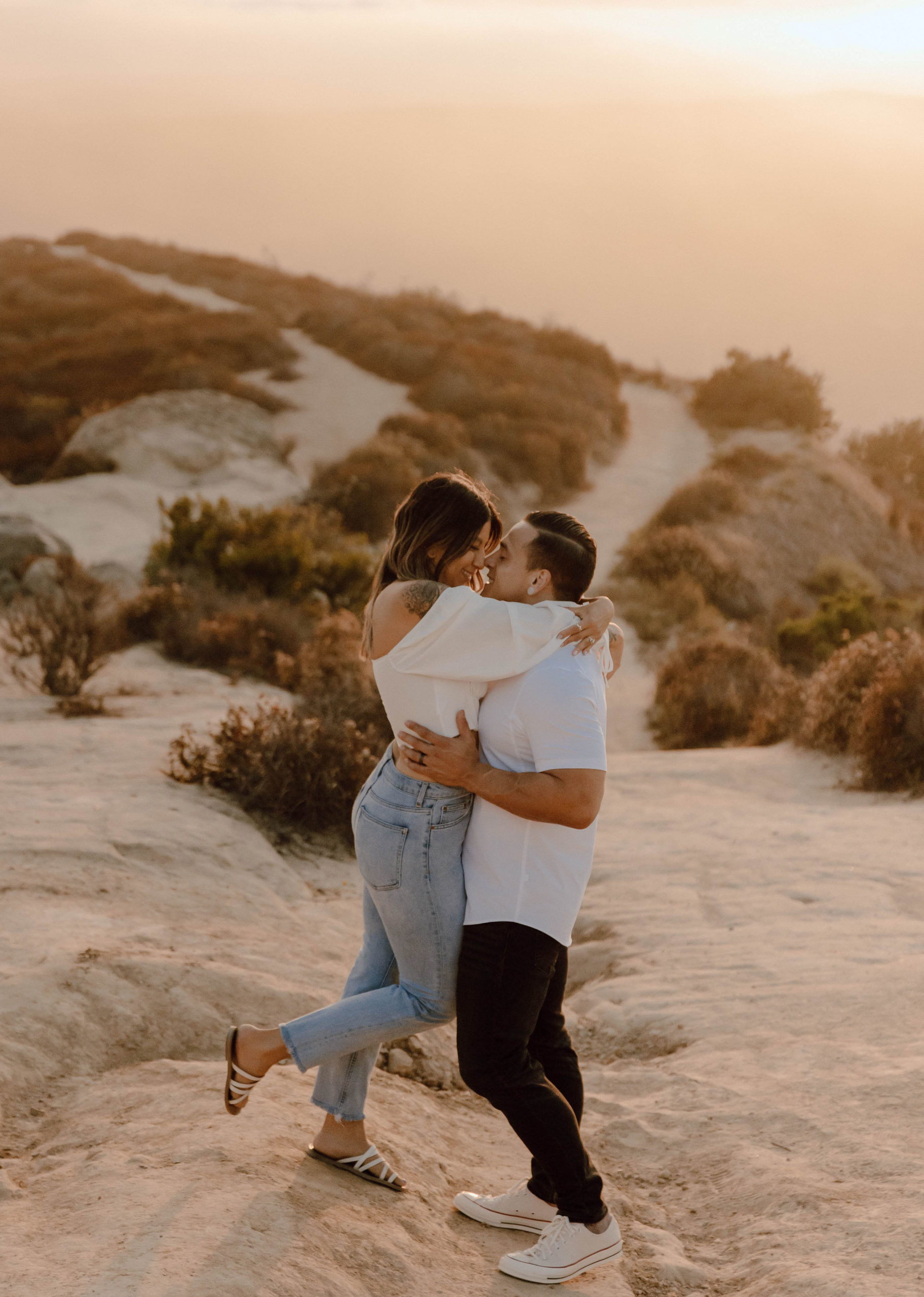 couple hugging at their Laguna Beach CA Couples Photoshoot